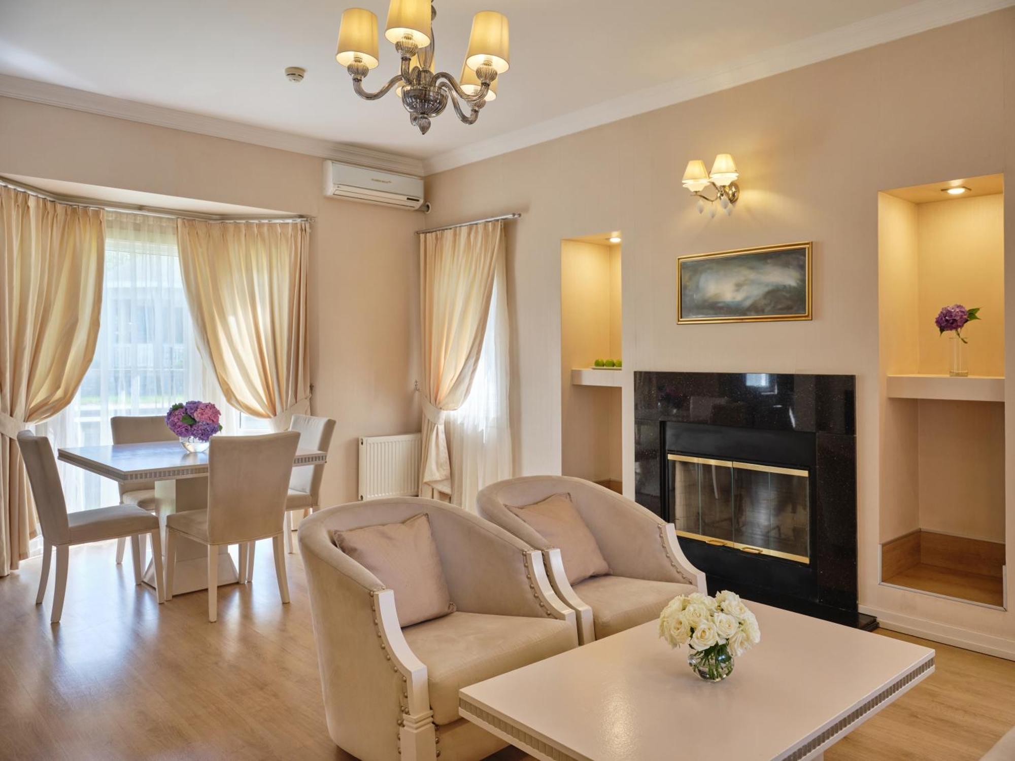 Qafqaz Riverside Hotel Gabala Exterior photo A living room with a fireplace