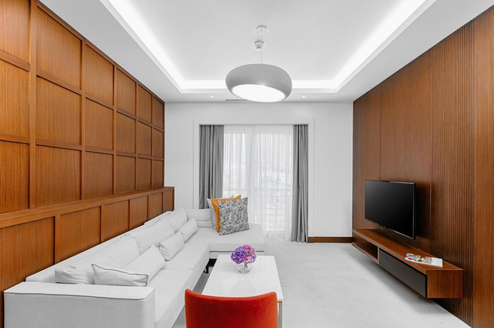 Qafqaz Riverside Hotel Gabala Exterior photo A living room with a white ceiling